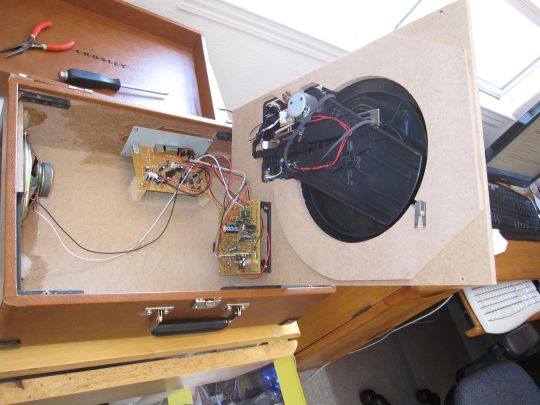 Photo shows the Crosley CR249 inside the case. The belt is dangling underneath the pulley.