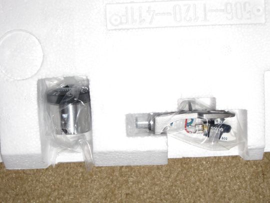 Photo shows a new headshell with a pre-mounted cartridge secured in styrofoam packaging.