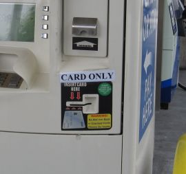 Close-up photo of a tattered looking credit card reader.