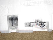 Cartridge and counterweight components in their original styrofoam packaging.
