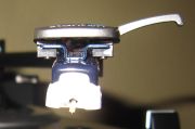 A very close-up photo of the Stanton T.92's 500.V3 cartridge mounted on its headshell.
