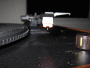 Close up photo shows the stylus (needle) and cartridge of the Crosley CR249 turntable.